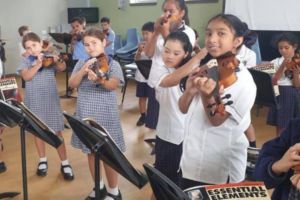 St Therese Lakemba students playing musical instruments